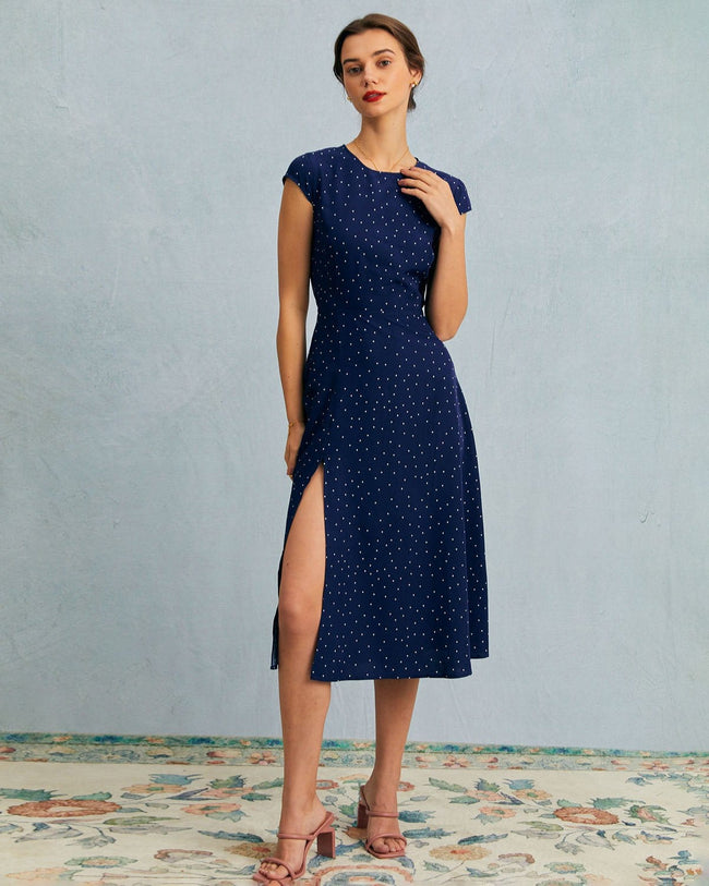 Navy polka dot midi dress for women by FJØRNA featuring a round neckline and stylish cutout detail.