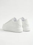 Back view of FJØRNA white lace-up men's minimalist trainers, designed for everyday style and casual wear.