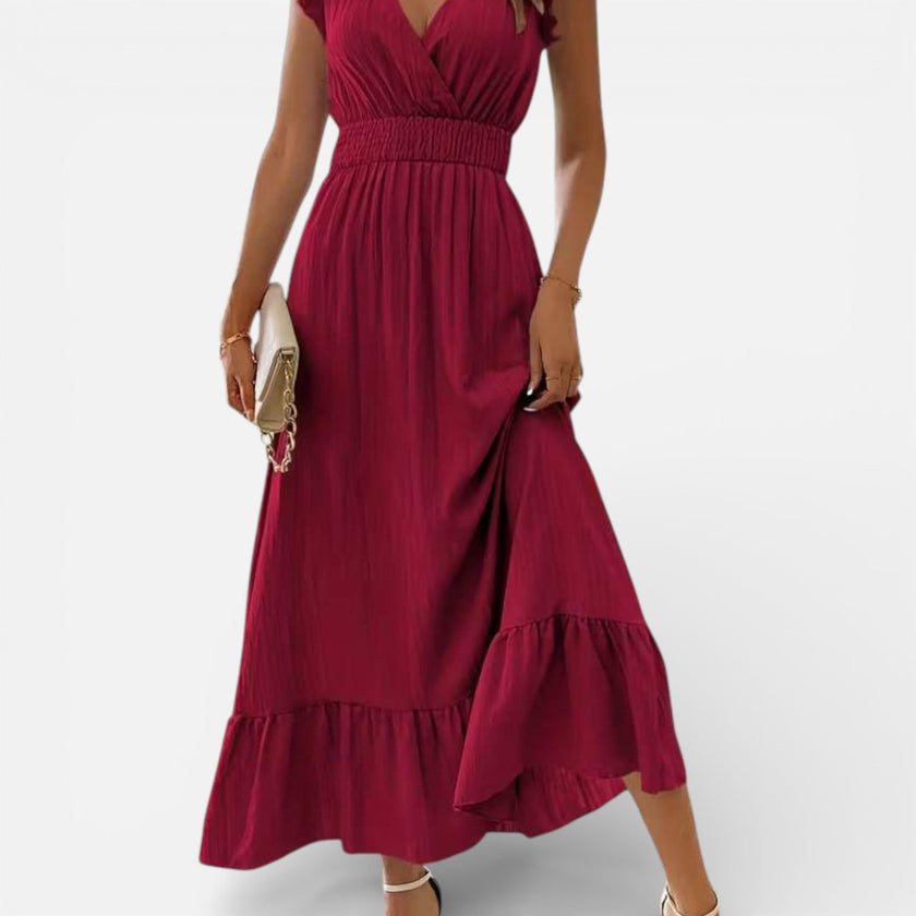 Women's flowy sleeveless maxi dress by FJØRNA featuring a timeless style and relaxed fit, perfect for warm-weather occasions.