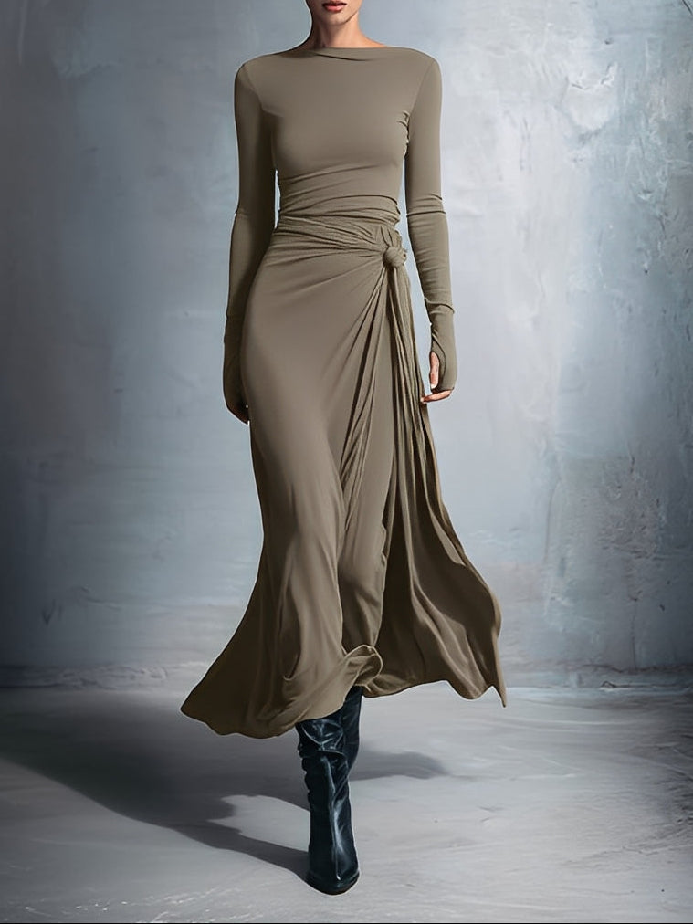 Flowy summer maxi dress for women by FJØRNA, featuring a wrap design and lightweight, breezy fabric for warm weather.