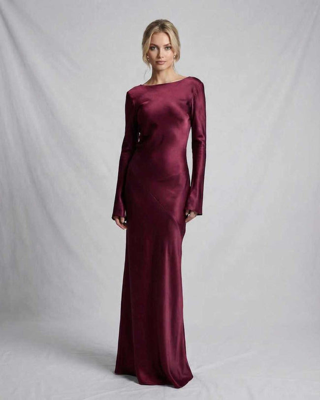 FJØRNA satin slim fit maxi dress in rich burgundy with a dramatic back, elegant evening gown for formal occasions.