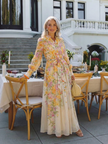 FJØRNA women's floral summer maxi dress with long sleeves, flowy fabric and elegant design for warm weather.