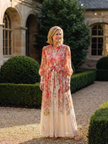 FJØRNA summer maxi dress for women with floral pattern, long sleeves, flowing fabric, perfect for warm weather.