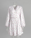 FJØRNA white floral V-neck mini dress with lantern sleeves, showcasing a stylish and feminine summer dress design.