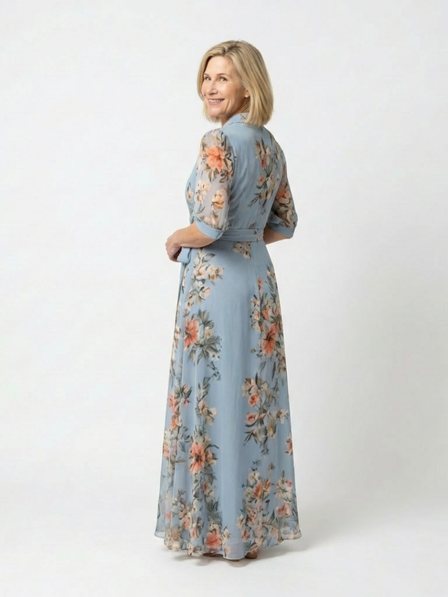 FJØRNA women's floral wrap summer maxi dress with flowing fabric and vibrant floral pattern, perfect for warm weather.