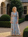 FJØRNA women's floral wrap summer maxi dress with a flowing silhouette and vibrant botanical print.