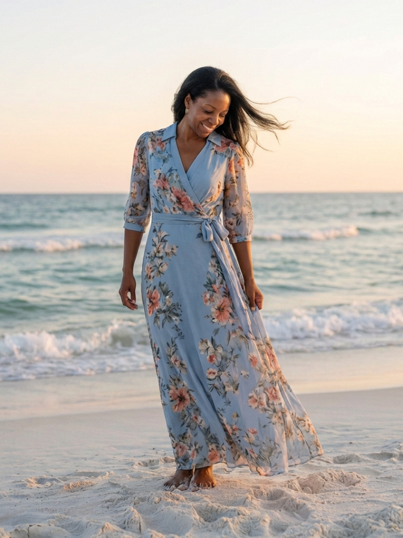 FJØRNA women's floral summer maxi dress with wrap style, flowing fabric and vibrant flower pattern for warm weather wear.