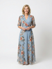 FJØRNA women's floral wrap summer maxi dress with a flowing silhouette and vibrant print, perfect for warm-weather occasions.