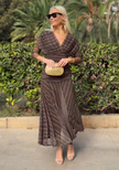 FJØRNA bohemian patterned V-neck mesh maxi dress with flowing fabric and intricate print, perfect for boho-inspired style.