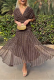 FJØRNA bohemian patterned v-neck mesh maxi dress featuring colorful, flowing fabric and a stylish V neckline for elegant summer wear.