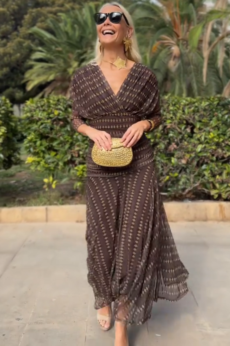 FJØRNA bohemian patterned V-neck mesh maxi dress with flowing fabric and intricate design, perfect for boho-chic style.
