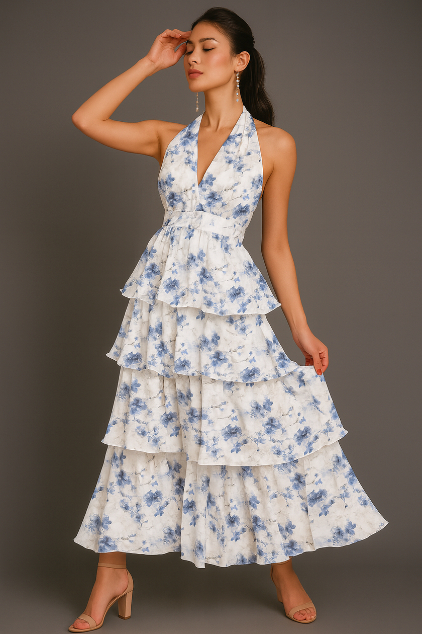 White FJØRNA halter floral tiered ruffle maxi dress with waist detail, perfect for summer or special occasions.