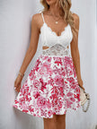 White FJØRNA sleeveless cutout sundress with floral lace details and a flared hem, shown from the front.