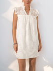 White lace mini dress by FJØRNA, casual summer wedding dress with a fitted bodice and delicate lace details, front view.