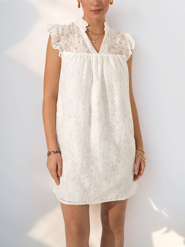 White lace mini dress by FJØRNA, casual summer wedding dress with a fitted bodice and delicate lace details, front view.