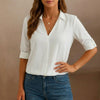 White V-neck denim summer blouse for women by FJØRNA, stylish top with relaxed fit and casual design.