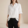 FJØRNA women's white denim summer blouse with ruffle details, casual style, short sleeves, and a relaxed fit.
