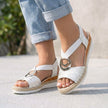White FJØRNA orthopedic peep-toe wedge sandals for women with supportive design and open toe, ideal for comfort and style.