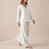 White FJØRNA two-piece women's co-ord set with V-neck top and pockets, stylish and comfortable for casual wear.