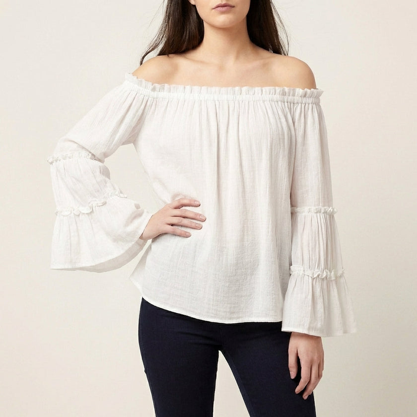 White off-shoulder bell sleeve summer blouse for women by FJØRNA, featuring flowy fabric and stylish design.
