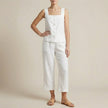 White two-piece women's co-ord set by FJØRNA featuring a button front top with a square neckline.