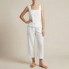 White two-piece women's co-ord set by FJØRNA featuring a button front top with a square neckline.
