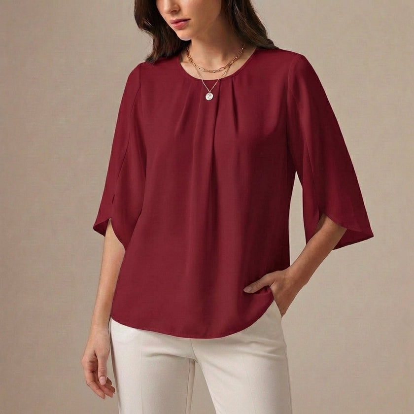 Wine red FJØRNA summer blouse for women with pleated casual design, featuring a relaxed fit and stylish neckline.