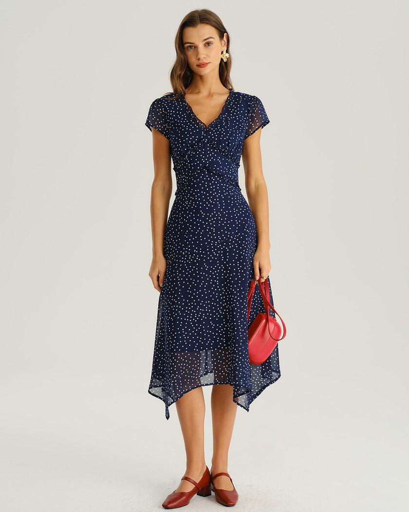 Navy blue polka dot chiffon midi dress with V-neck, tiered ruffles, and short sleeves, designed for women by FJØRNA.