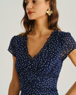Navy blue polka dot chiffon midi dress for women with V-neck, tiered ruffle short sleeves, by FJØRNA.