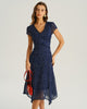 Navy blue polka dot chiffon midi dress for women with V-neck, tiered ruffle short sleeves, by FJØRNA.