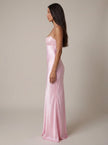 Women's satin halter maxi dress with beaded details by FJØRNA, shown as a formal evening dress on a model.