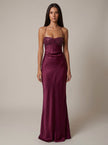 Women's satin halter maxi dress by FJØRNA featuring beaded embellishments and a flowing formal design.