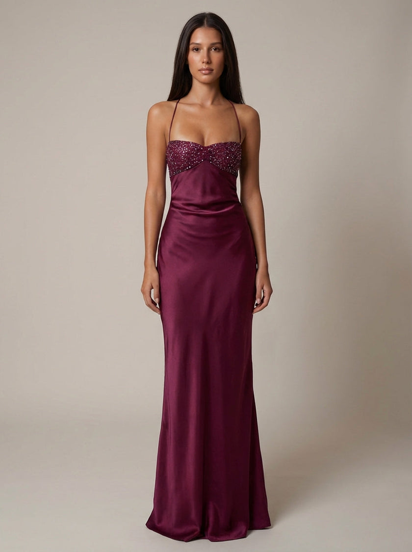 Women's satin halter maxi dress by FJØRNA featuring beaded embellishments and a flowing formal design.