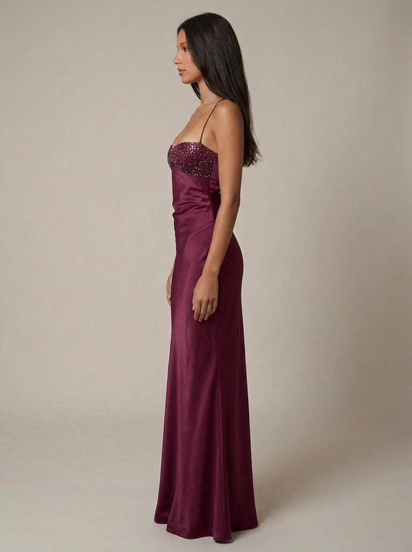 Women's satin halter maxi dress with beaded details, by FJØRNA, featuring a formal design and elegant flowing silhouette.