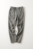 FJØRNA women's wool blend trousers showing tailored fit and classic design, with front pockets and a neutral color.