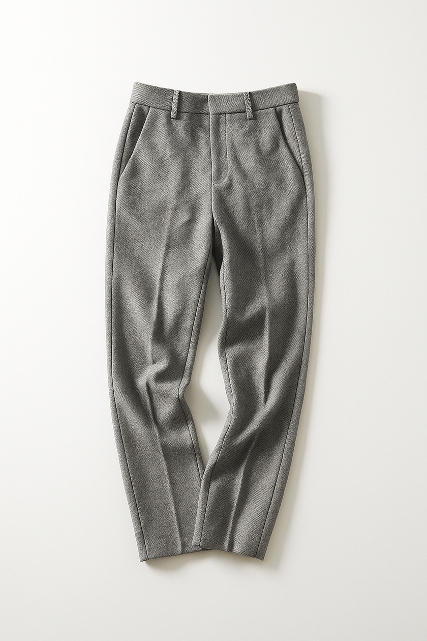 FJØRNA women's wool blend trousers showing tailored fit and classic design, with front pockets and a neutral color.