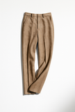 FJØRNA women's wool blend trousers featuring tailored fit and classic design, shown in a neutral color on a model.