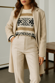 FJØRNA women's wool blend trousers featuring a tailored fit, in neutral color with front pockets and a classic waistband.