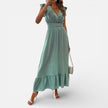 Women's sleeveless maxi dress by FJØRNA, flowy fit with a timeless style, shown in a natural, elegant pose.