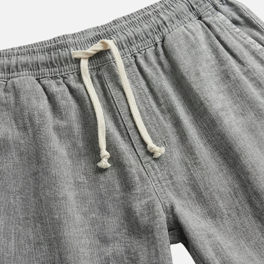 Men's linen shorts by FJØRNA with elasticated waist and drawstring, perfect for summer beachwear and casual outdoor wear.