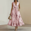 Women's white printed V-neck sleeveless pleated dress by FJØRNA, showcasing a stylish and flowy summer dress with pleats.