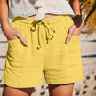 FJØRNA women's lightweight summer shorts with wide legs, drawstring waist, and side pockets, perfect for warm weather.