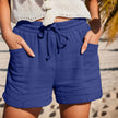 FJØRNA lightweight summer women's shorts with wide legs, drawstring waist, and side pockets, perfect for casual warm-weather wear.