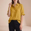 Yellow denim ruffle summer blouse for women by FJØRNA, casual top with sleeveless design and feminine ruffle details.