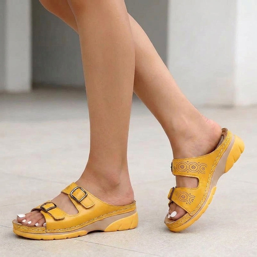 Yellow FJØRNA orthopedic buckle platform slide sandals for women, featuring wide straps and cushioned soles.