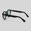 Men's round acetate sunglasses by FJØRNA with casual style, featuring a classic circular frame and tinted lenses.