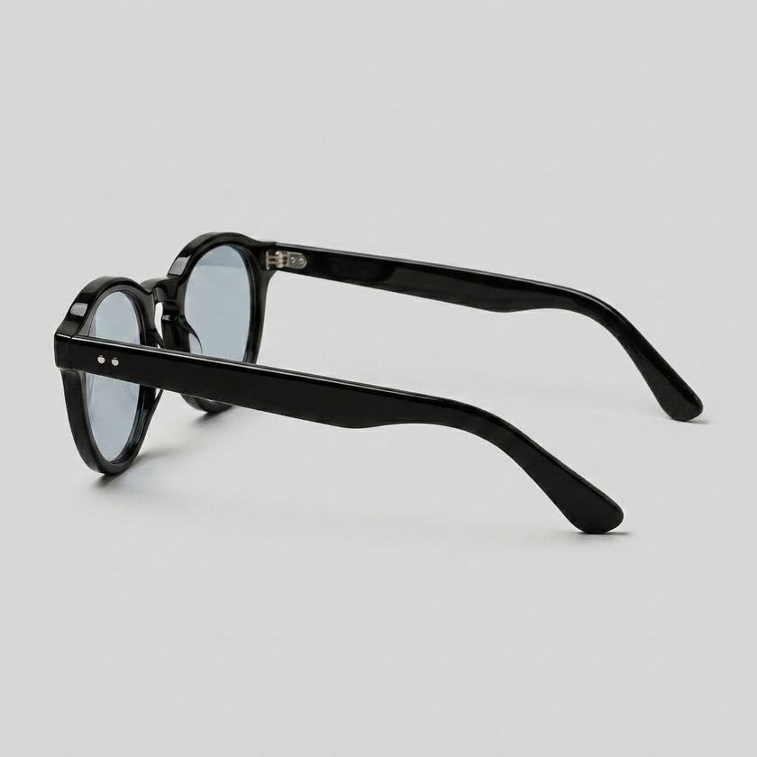 Men's round acetate sunglasses by FJØRNA with casual style, featuring a classic circular frame and tinted lenses.