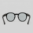 Men's round acetate sunglasses by FJØRNA with casual style, featuring black frames and dark tinted lenses.