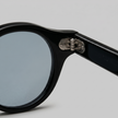 Men's round acetate sunglasses in casual style by FJØRNA, featuring a classic frame and dark tinted lenses.