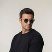 FJØRNA men's polarized outdoor sunglasses with glare-reducing lenses, stylish black frame, and reflective lenses for outdoor activities.